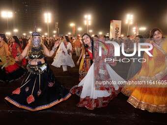 Participants perform 'Garba' during the Dainik Bhaskar Abhivyakti 'Garba Mahotsav' on the occasion of the 'Navratri festival' in Jaipur, Raj...