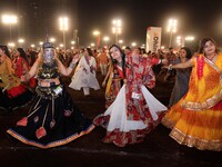 Participants perform 'Garba' during the Dainik Bhaskar Abhivyakti 'Garba Mahotsav' on the occasion of the 'Navratri festival' in Jaipur, Raj...