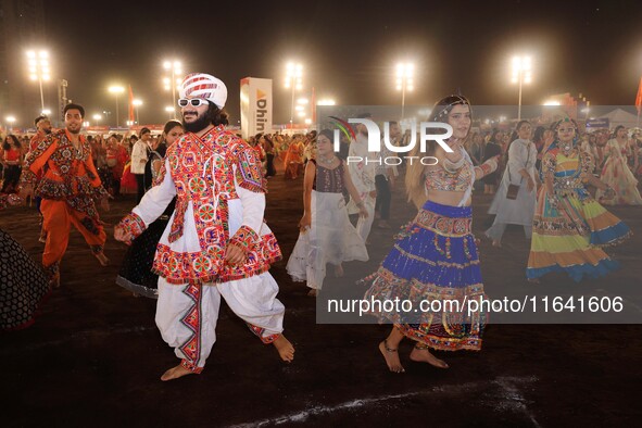 Participants perform 'Garba' during the Dainik Bhaskar Abhivyakti 'Garba Mahotsav' on the occasion of the 'Navratri festival' in Jaipur, Raj...