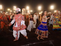 Participants perform 'Garba' during the Dainik Bhaskar Abhivyakti 'Garba Mahotsav' on the occasion of the 'Navratri festival' in Jaipur, Raj...