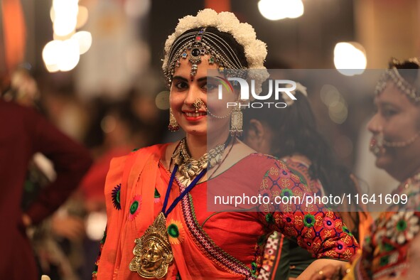 A participant takes part in the Dainik Bhaskar Abhivyakti 'Garba Mahotsav' during the 'Navratri festival' in Jaipur, Rajasthan, India, on Oc...