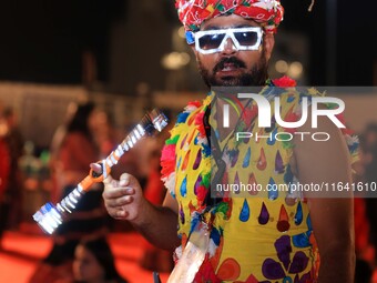 A participant takes part in the Dainik Bhaskar Abhivyakti 'Garba Mahotsav' during the 'Navratri festival' in Jaipur, Rajasthan, India, on Oc...