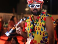 A participant takes part in the Dainik Bhaskar Abhivyakti 'Garba Mahotsav' during the 'Navratri festival' in Jaipur, Rajasthan, India, on Oc...