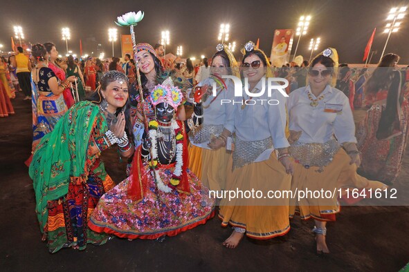 Participants attend the Dainik Bhaskar Abhivyakti 'Garba Mahotsav' during the 'Navratri festival' in Jaipur, Rajasthan, India, on October 5,...