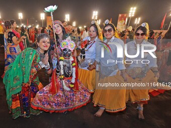 Participants attend the Dainik Bhaskar Abhivyakti 'Garba Mahotsav' during the 'Navratri festival' in Jaipur, Rajasthan, India, on October 5,...