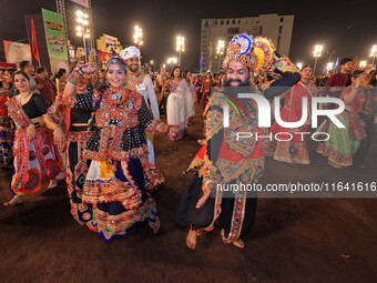 Participants perform 'Garba' during the Dainik Bhaskar Abhivyakti 'Garba Mahotsav' on the occasion of the 'Navratri festival' in Jaipur, Raj...