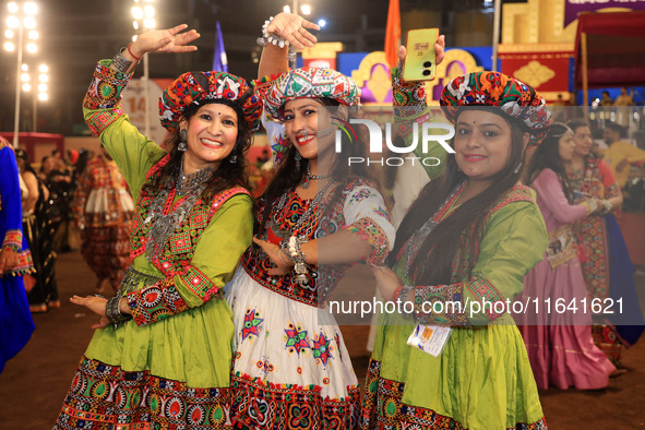 Participants perform 'Garba' during the Dainik Bhaskar Abhivyakti 'Garba Mahotsav' on the occasion of the 'Navratri festival' in Jaipur, Raj...