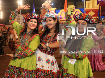 Participants perform 'Garba' during the Dainik Bhaskar Abhivyakti 'Garba Mahotsav' on the occasion of the 'Navratri festival' in Jaipur, Raj...