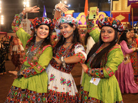 Participants perform 'Garba' during the Dainik Bhaskar Abhivyakti 'Garba Mahotsav' on the occasion of the 'Navratri festival' in Jaipur, Raj...