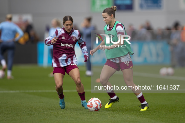 West Ham United F.C. players warm up during the Barclays FA Women's Super League match between Manchester City and West Ham United at the Jo...