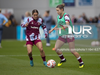 West Ham United F.C. players warm up during the Barclays FA Women's Super League match between Manchester City and West Ham United at the Jo...