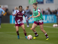 West Ham United F.C. players warm up during the Barclays FA Women's Super League match between Manchester City and West Ham United at the Jo...