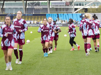 West Ham United F.C. players warm up during the Barclays FA Women's Super League match between Manchester City and West Ham United at the Jo...