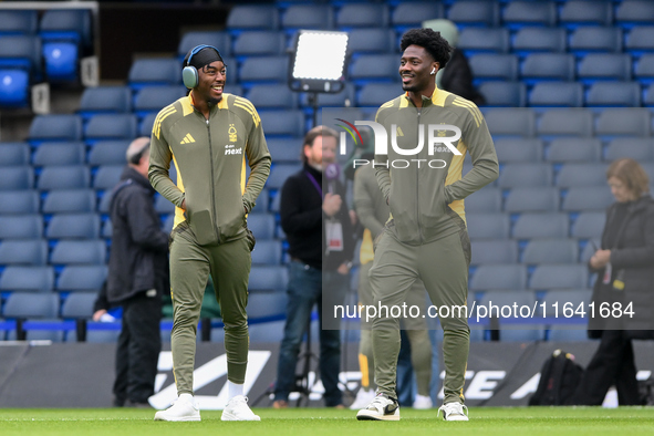 Anthony Elanga and Ola Aina of Nottingham Forest inspect the pitch ahead of the Premier League match between Chelsea and Nottingham Forest a...