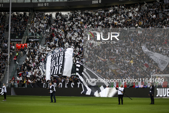 Juventus supporters cheer during the Serie A football match number 7, Juventus vs. Cagliari, at the Allianz Stadium in Turin, Piedmont, Ital...