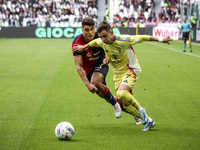 Juventus forward Francisco Conceicao (7) fights for the ball against Cagliari defender Adam Obert (33) during the Serie A football match num...