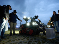 Visitors look at a Shark Robotics firefighting robot at the Warsaw Institute of Aviation in Warsaw, Poland on 04 October, 2024. The annual A...