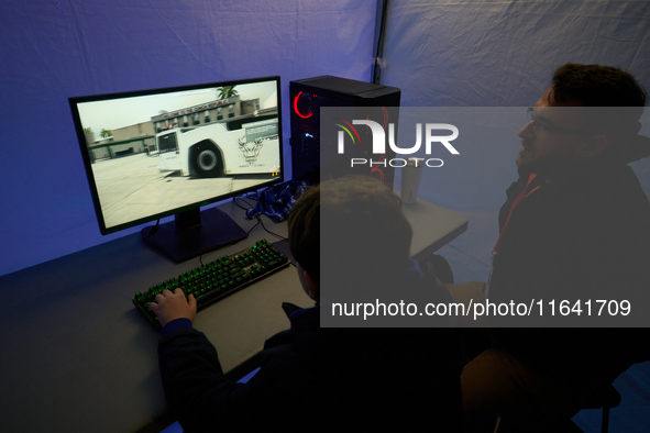 A visitor plays a pushback tractor simulator at the Warsaw Institute of Aviation in Warsaw, Poland on 04 October, 2024. The annual Aviation...