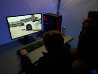 A visitor plays a pushback tractor simulator at the Warsaw Institute of Aviation in Warsaw, Poland on 04 October, 2024. The annual Aviation...