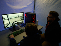 A visitor plays a pushback tractor simulator at the Warsaw Institute of Aviation in Warsaw, Poland on 04 October, 2024. The annual Aviation...