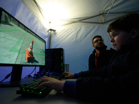 A visitor plays a pushback tractor simulator at the Warsaw Institute of Aviation in Warsaw, Poland on 04 October, 2024. The annual Aviation...