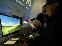 A visitor plays a flight simulator at the Warsaw Institute of Aviation in Warsaw, Poland on 04 October, 2024. The annual Aviation Night is a...