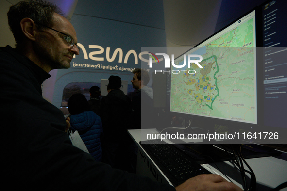 A visitor looks at an air control system at the Warsaw Institute of Aviation in Warsaw, Poland on 04 October, 2024. The annual Aviation Nigh...