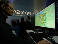 A visitor looks at an air control system at the Warsaw Institute of Aviation in Warsaw, Poland on 04 October, 2024. The annual Aviation Nigh...