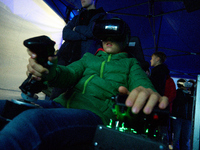 A visitor flies a fighter jet simulator at the Warsaw Institute of Aviation in Warsaw, Poland on 04 October, 2024. The annual Aviation Night...