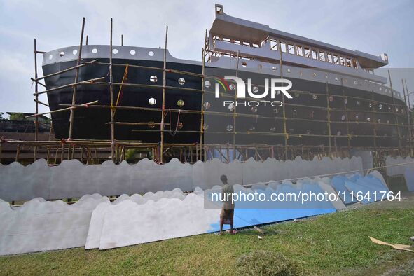 Workers make a Titanic ship as a pandal for the Durga Puja festival in Nagaon District, Assam, India, on October 6, 2024. 