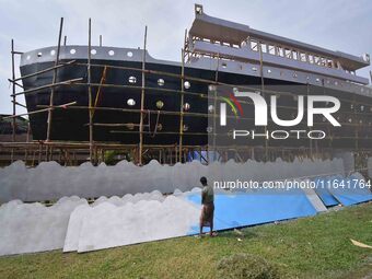 Workers make a Titanic ship as a pandal for the Durga Puja festival in Nagaon District, Assam, India, on October 6, 2024. (