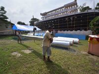 Workers make a Titanic ship as a pandal for the Durga Puja festival in Nagaon District, Assam, India, on October 6, 2024. (