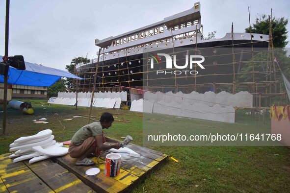 Workers make a Titanic ship as a pandal for the Durga Puja festival in Nagaon District, Assam, India, on October 6, 2024. 