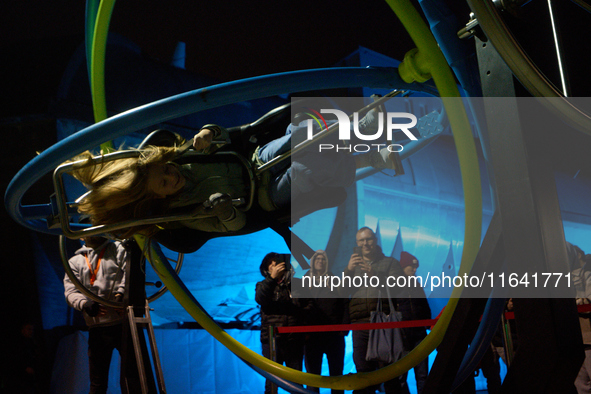 A visitor experiences an aerotrim at the Warsaw Institute of Aviation in Warsaw, Poland on 04 October, 2024. The annual Aviation Night is an...