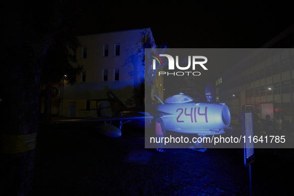 Visitors observe an old fighter jet at the Warsaw Institute of Aviation in Warsaw, Poland on 04 October, 2024. The annual Aviation Night is...