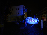 Visitors observe an old fighter jet at the Warsaw Institute of Aviation in Warsaw, Poland on 04 October, 2024. The annual Aviation Night is...