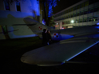 Visitors observe an old fighter jet at the Warsaw Institute of Aviation in Warsaw, Poland on 04 October, 2024. The annual Aviation Night is...