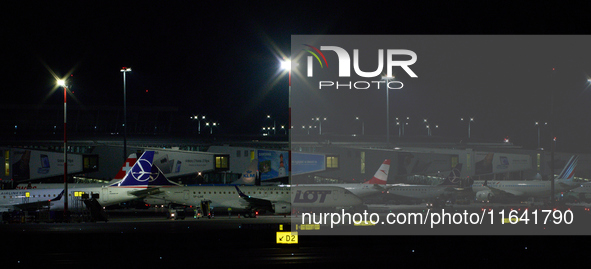 LOT Polish Airlines passenger jets are seen on the tarmac at Chopin Airport from the Warsaw Institute of Aviation in Warsaw, Poland on 04 Oc...