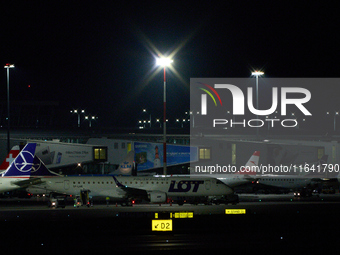 LOT Polish Airlines passenger jets are seen on the tarmac at Chopin Airport from the Warsaw Institute of Aviation in Warsaw, Poland on 04 Oc...