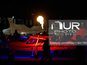 Flames from a hot air balloon burner rise above a parked Tecnam P2008JC MkII at the Warsaw Institute of Aviation in Warsaw, Poland on 04 Oct...