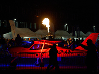 Flames from a hot air balloon burner rise above a parked Tecnam P2008JC MkII at the Warsaw Institute of Aviation in Warsaw, Poland on 04 Oct...