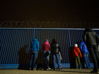 Visitors observe the runway at the Chopin airport at the Warsaw Institute of Aviation in Warsaw, Poland on 04 October, 2024. The annual Avia...