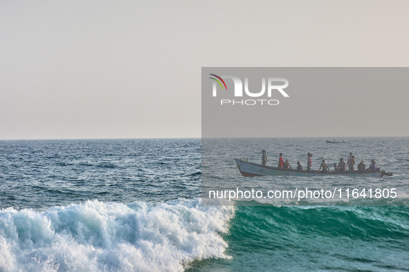 A boat is in the ocean along Paruthiyoor Beach in Paruthiyoor, Kerala, India, on April 15, 2024. 