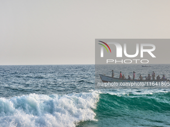 A boat is in the ocean along Paruthiyoor Beach in Paruthiyoor, Kerala, India, on April 15, 2024. (