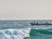 A boat is in the ocean along Paruthiyoor Beach in Paruthiyoor, Kerala, India, on April 15, 2024. (