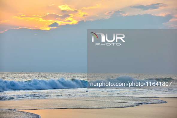 The sun sets along Paruthiyoor Beach in Paruthiyoor, Kerala, India, on April 15, 2024. 