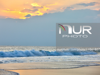 The sun sets along Paruthiyoor Beach in Paruthiyoor, Kerala, India, on April 15, 2024. (