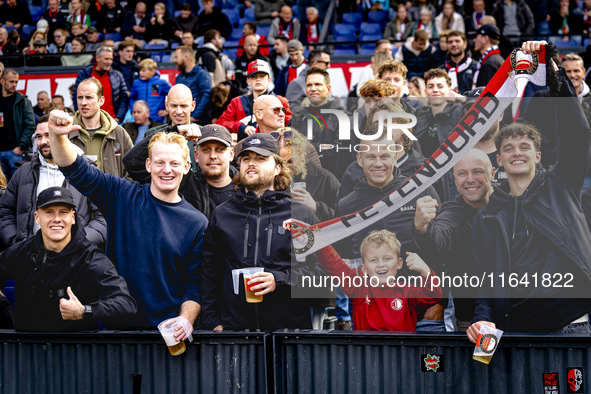 Supporters of Feyenoord Rotterdam attend the match between Feyenoord and Twente at the Feyenoord stadium De Kuip for the Dutch Eredivisie se...