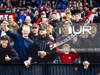 Supporters of Feyenoord Rotterdam attend the match between Feyenoord and Twente at the Feyenoord stadium De Kuip for the Dutch Eredivisie se...