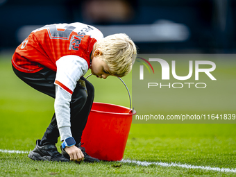 A young grass boy is present during the match between Feyenoord and Twente at the Feyenoord stadium De Kuip for the Dutch Eredivisie season...